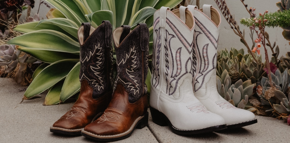 boy and girl boots on sidewalk.
