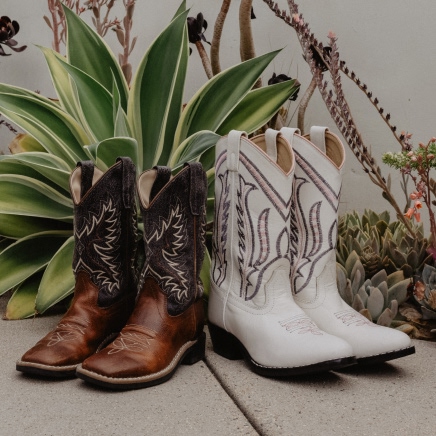 boy and girl boots on sidewalk