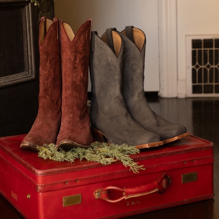 brown mens and women boots.