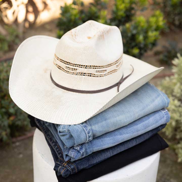  denim stacked with hat on top