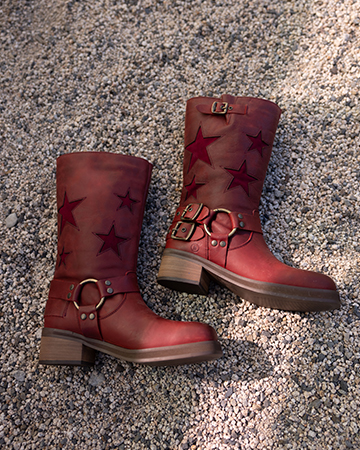 red star boots on gravel.