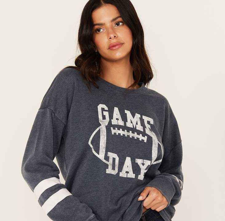 Woman in game day sweatshirt