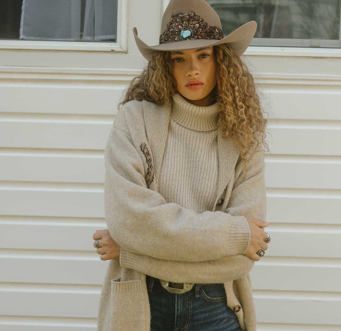 woman wearing hat and sweater