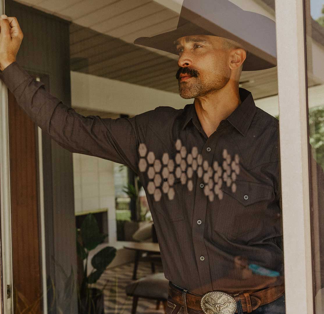 Man leaning in long sleeve top