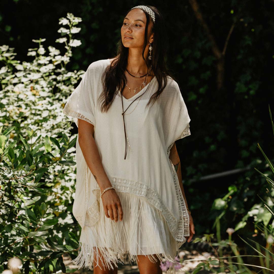 woman wearing a flowy poncho.