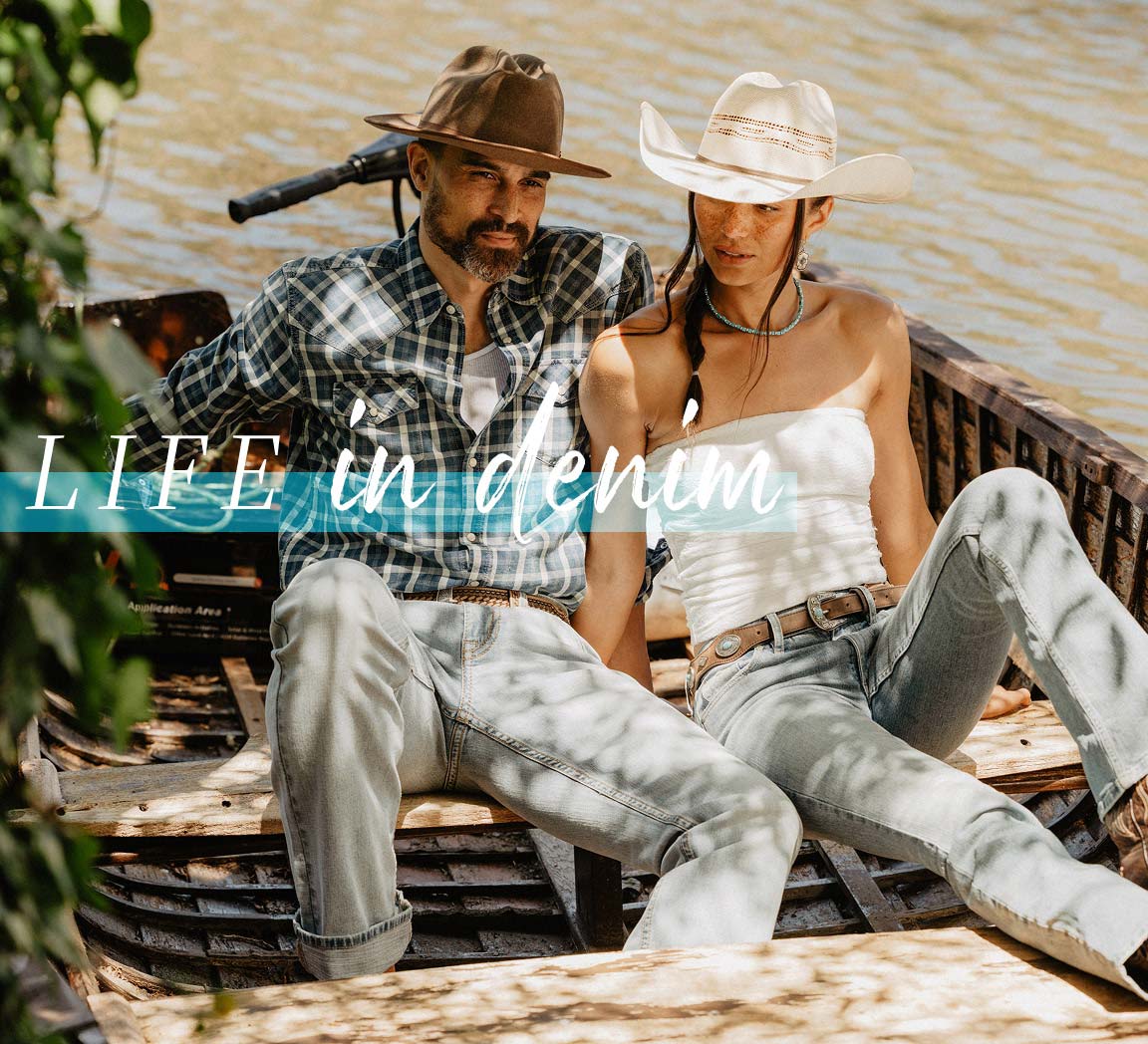 men and woman in a boot wearing a shirt and jeans