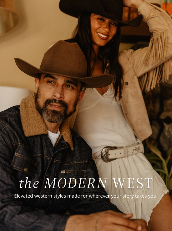  man and woman sitting in living room in western wear